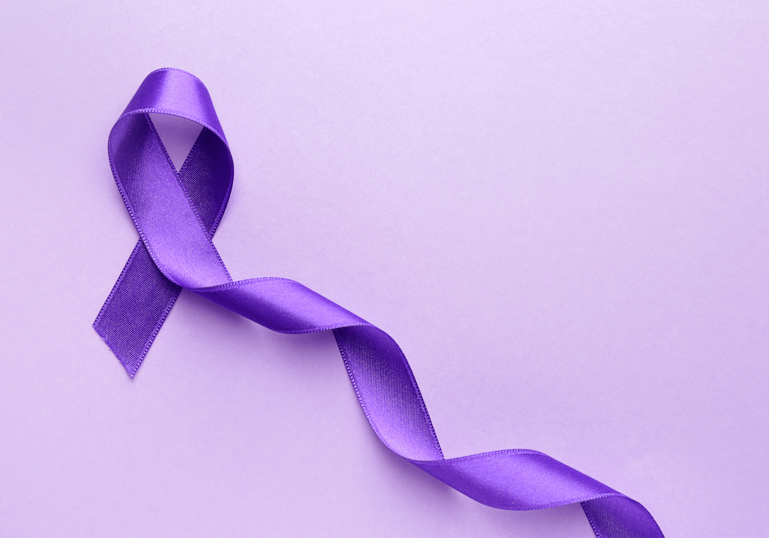 Purple awareness ribbon on a matching purple background, looped in the classic shape.